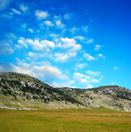 Dinara mountain over blue clouds. South Croatiaの写真素材