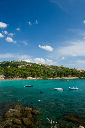 Adriatic sea beach in Croatia full of touristsの写真素材