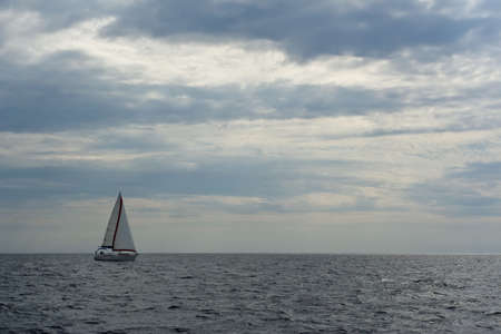 Sailboat sailing during cloudy summer day, Adriatic sea, Croatiaの写真素材