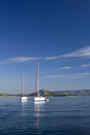 Two sail boats preparing for sailing, Adriatic sea, Croatiaの写真素材