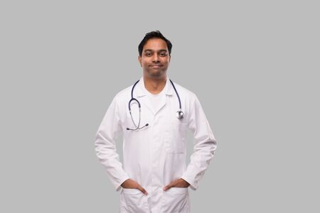 Male Doctor Portrait Standing Smiling. Isolated. Medical Conceptの写真素材