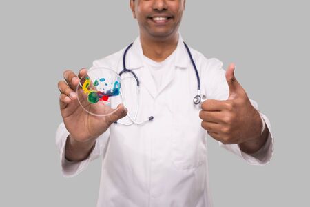 Indian Man Doctor Holding Petri Dish Showing Thumb Up Isolated Close Up. Medicine, Science Concept. Manの写真素材