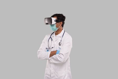 Doctor Wearing VR Glasses, Medical mask and Gloves Hands Grossed Isolated. Medicの写真素材