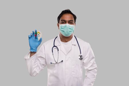 Doctor Holding Petri Dish Wearing Medical Mask and Gloves Isolated. Medicine, Science Conceptの写真素材