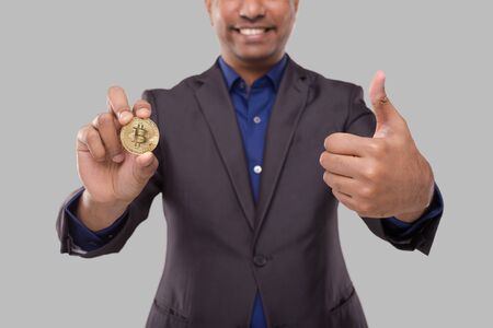 Businessman Showing Bitcoin and Thumb Up. Business man Cypto Currency. Signの写真素材