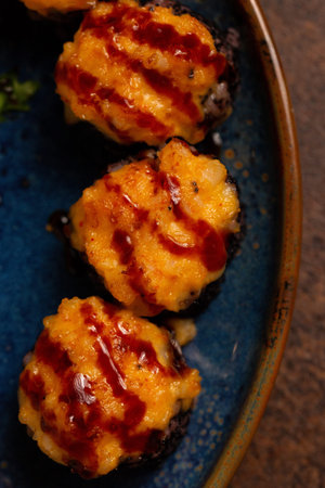 Baked Sushi Rolls on Plate with Sauce Close Up. Asian Healthy Food