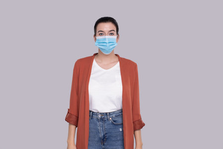 Girl Wearing Medical Mask Isolated. Woman In Office look with Medical Mask. Health, Virus, Medical Conceptの写真素材