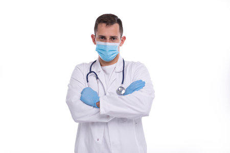 Doctor Wearing Medical Mask and Gloves Hands Crossed Isolated. Man Doctor Hands Crossed Medical Concept.の写真素材