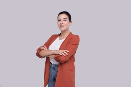 Girl Standing Hands Crossed Isolated Smilling. Girl Smillingの写真素材