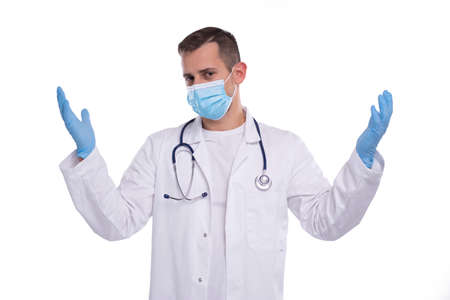 Doctor Wearing Medical Mask and Gloves Holding Hands to Sides Isolatedの写真素材