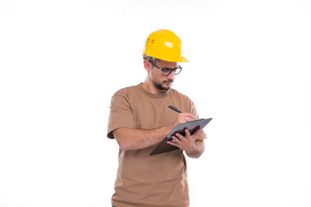 Man Construction Worker Writing in Clipboard Isolated. Man Builder Working with Clipboard. Commecial, Shopping, Advertisment Conceptの写真素材