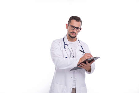 Doctor Man Writing in Clipboard Isolated. Doctor Working with Clipboard. Commecial, Shopping, Advertisment Conceptの写真素材