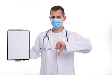 Doctor Man Showing Blank Clipboard and Thumb Down Isolated. Advertisment, Office, Commercial Conceptの写真素材