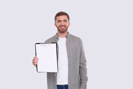 Office Man Showing Blank Clipboard Isolated. Advertisment, Office, Commercial Concept. Office Workerの写真素材