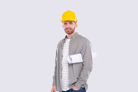 Construction Worker Holding House Plan in Hands. Architect Holding Blueprints. Yellow Hard Helmet. Workerの写真素材