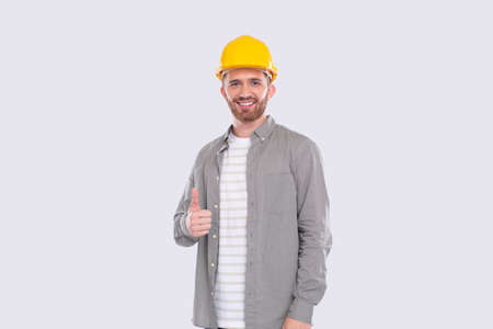Construction Worker Showing Thumb Up Smilling Isolated Standingの写真素材