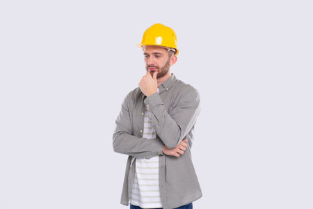 Construction Worker Standing Thinking. Architect Analysing Work. Man Standing in Hard Helmet...