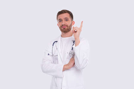 Doctor Having A Great Idea. Man with Idea Holding Finger Up. Medical Worker Isolatedの写真素材