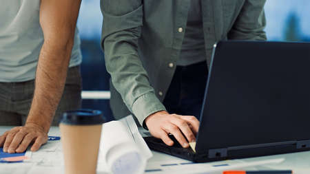 Creative Team at Work. Team Work. Man Working on Laptop. Workspace. Designersの写真素材