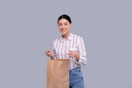 Girl Holding Shopping bag. Girl Shopping. Shopping Concept Isolatedの写真素材
