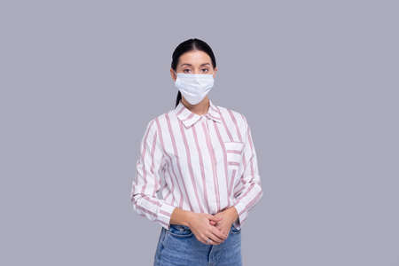 Girl Wearing Medical Mask Isolated. Woman In Office look with Medical Mask. Health, Virus, Medical Concept Isolatedの写真素材