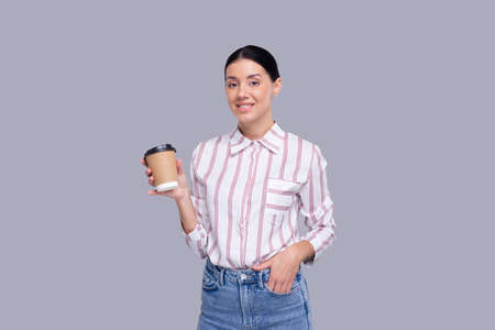 Girl Holding Coffee Take Away Cup. Girl With To Go Coffee Cup in Hands Isolatedの写真素材
