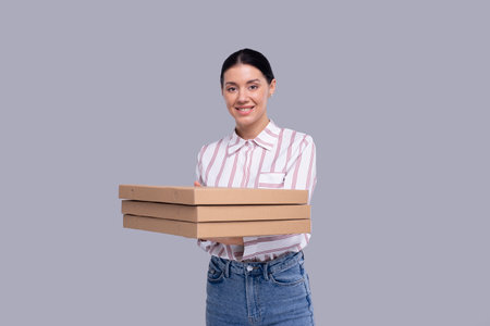Girl Holding Three Pizza Boxes Isolated. Fast Food, Unhealthy food Conceptの写真素材