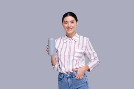 Girl Holding Tin Can Girl With Beer Bottle in Hands. Alcohol Drink Can Isolatedの写真素材
