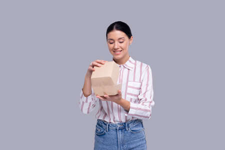 Girl Holding Burger Box Isolated. Fast Food, Unhealthy food Concept. Burger in Delivery Boxの写真素材