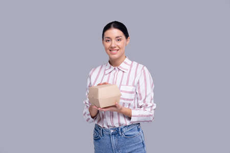 Girl Holding Burger Box. Fast Food, Unhealthy food Concept. Burger in Delivery Boxの写真素材