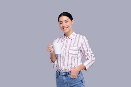 Girl Holding Coffee Cup. Girl With Coffee Cup in Hands. Tea Cup. Morning Conceptの写真素材