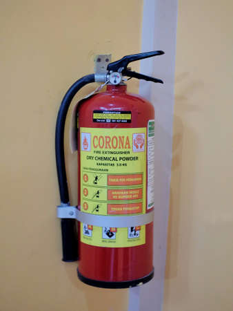 Yogyakarta, Indonesia, March 4, 2020. Fire extinguishers are attached to the walls of the room to anticipate emergency situationsのeditorial素材