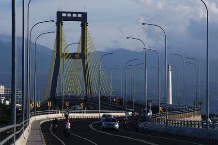Manado, Indonesia, July 29, 2017: Soekarno Bridge, the bridge that passes over the port of Manado becomes a new icon one of the tourist destinations on the island of North Sulawesi.のeditorial素材