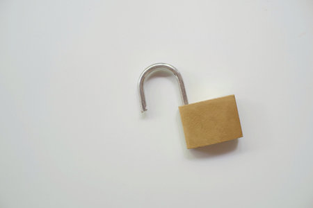 Padlock is made of brass material when it is openの写真素材