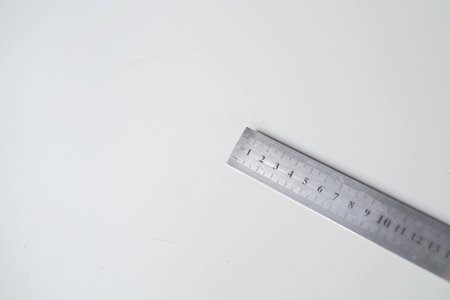 Silver copper ruler in centimeter number isolated on whiteの写真素材
