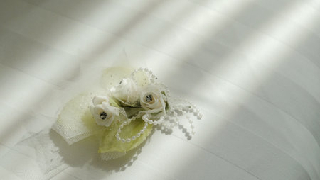 White corsage flowers with beads which are used for decoration or accessories on formal male clothesの写真素材