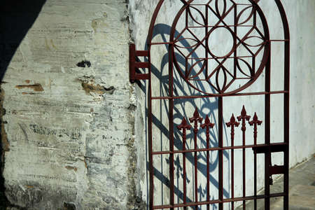 A thick and sturdy fortress with a trellis door as a gateの写真素材