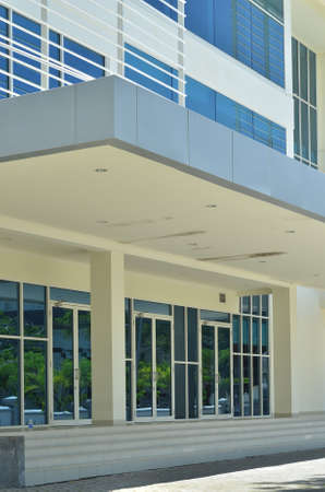 A new building with a modern architectural style, a mix of angular construction and glass facades.の写真素材