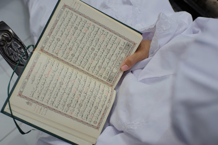 A Muslim woman is reading the holy Koran