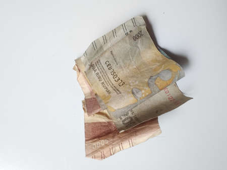 Klaten, Indonesia, Jan 25, 2021. Currency worth 5000 rupiah and 2000 rupiah officially issued by Bank Indonesia and used as a transaction tool in a shabby and disheveled state.のeditorial素材