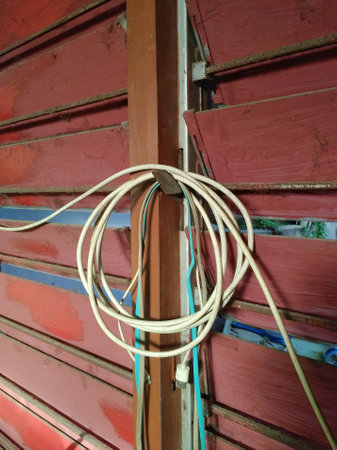 Power cables that are too long are simply coiled to prevent tanglesの写真素材