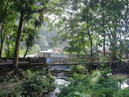 Tasikmalaya, Indonesia, 20 Jan 2021. Bridge over a natural river in the beautiful hot spring area of Mount Galunggung.のeditorial素材