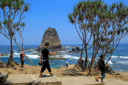 Jember, Indonesia, Sept 12, 2015. Local tourists visit Papuma Beach. Tanjung Papuma is a type of beach that has large waves as it faces directly to the Indian Oceanのeditorial素材