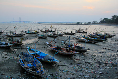 Madura, Indonesia, Oct 29, 2015. A traditional fishing boat docked in the Madura Strait in the afternoonのeditorial素材