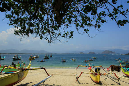 Jember, Indonesia, Sept 12, 2015. Fisherman boat at Tanjung Papuma Beach. The charm of white sand with blue sea lies along the coast.のeditorial素材