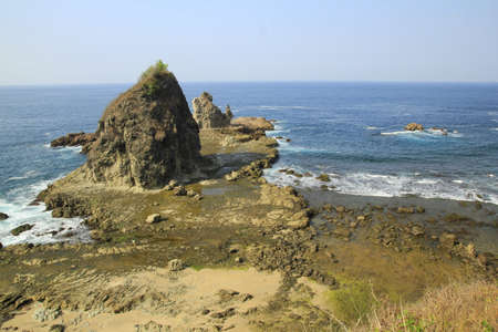 Watu Lumbung beach, hidden beach in Gunungkidul Yogyakarta with beautiful coral charm combined with the waves of Indian Ocean.の写真素材