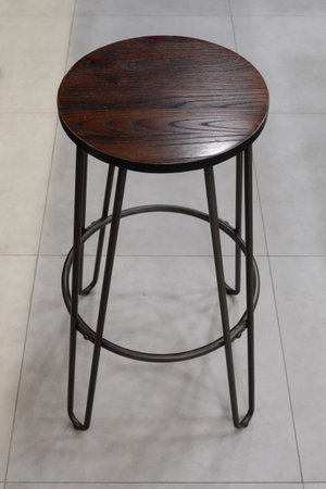 Vintage finished wooden chairs with metal frame supports give an image of industrial style...