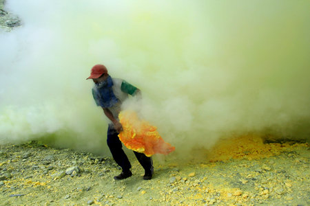 Banyuwangi, Indonesia, May 27, 2015. Sulfur miners in the Ijen crater. The health condition of...