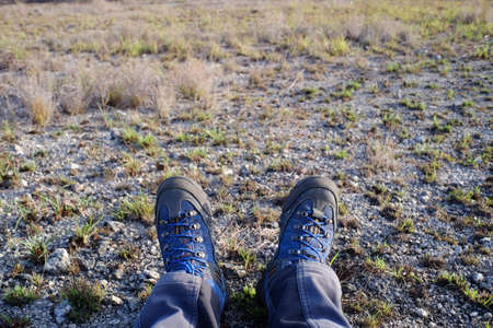 Outdoor shoes with subjective shoot in savannah field.の写真素材