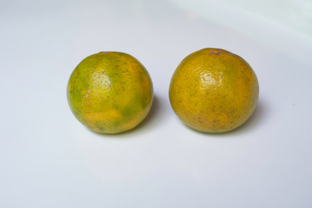 Organic citrus fruit with glossy skin isolated on white.の写真素材